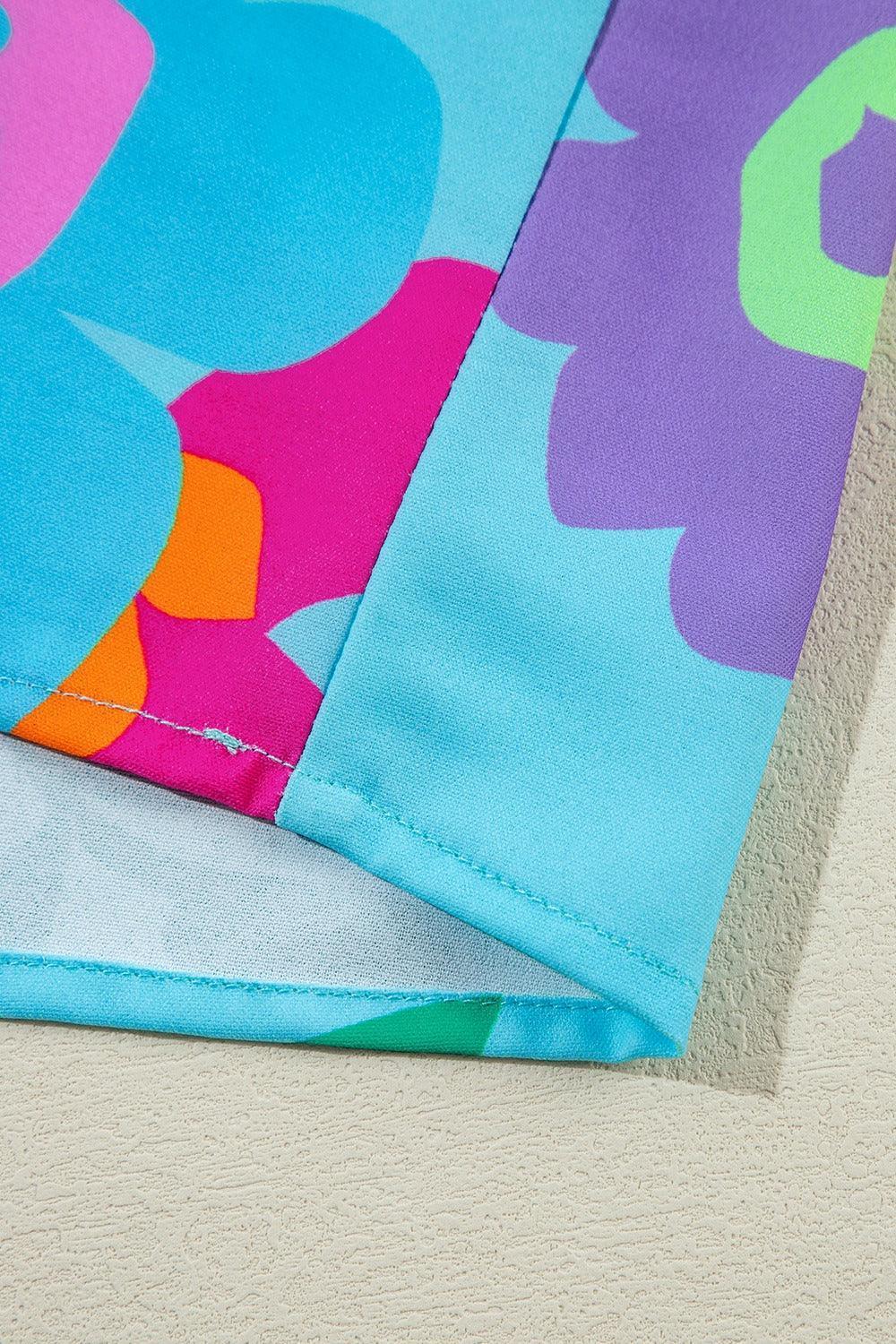 Plus Size Peplum Printed Notched Blouse - ClubOn