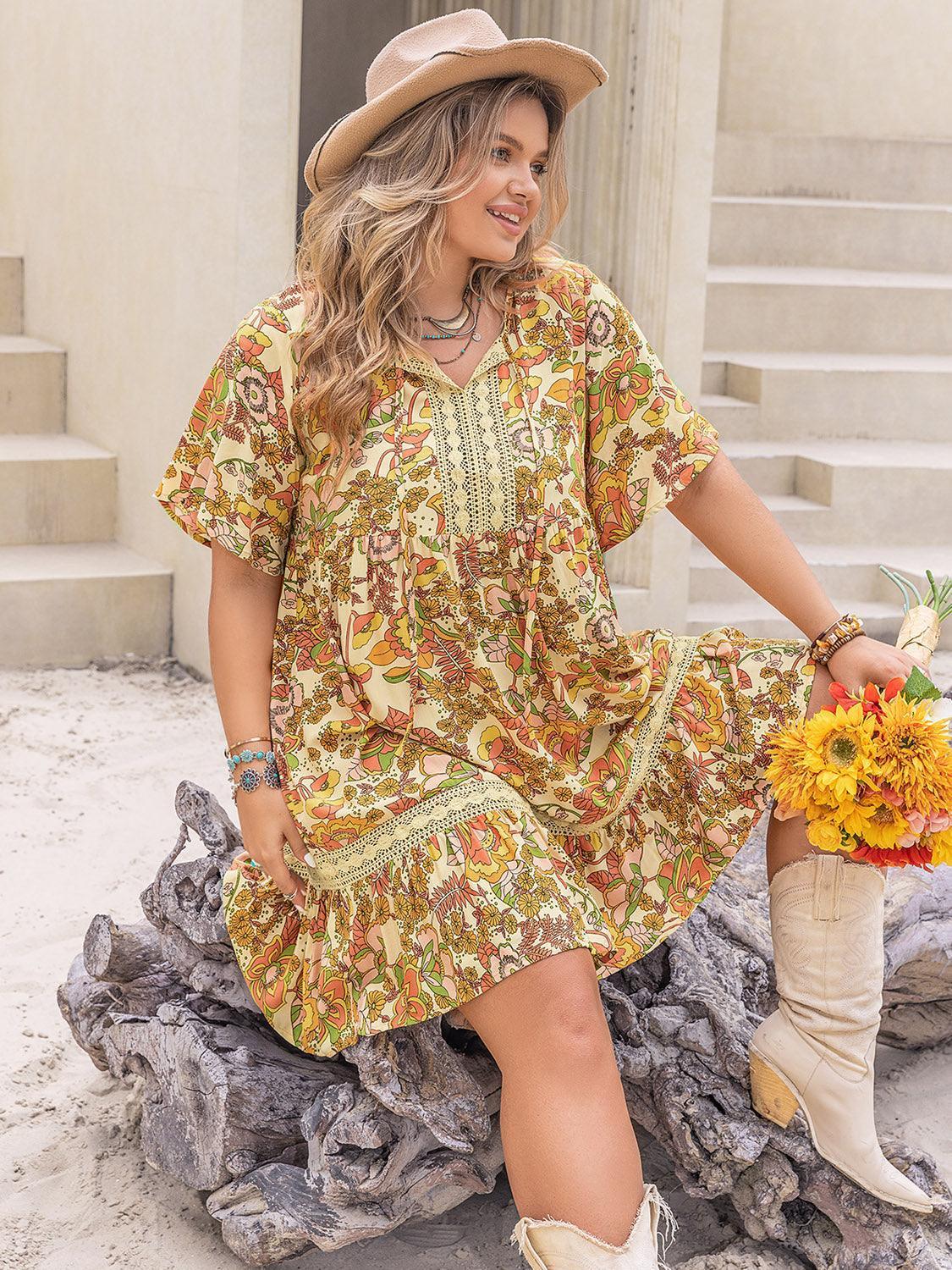Plus Size Printed Tie Neck Short Sleeve Mini Dress - ClubOn