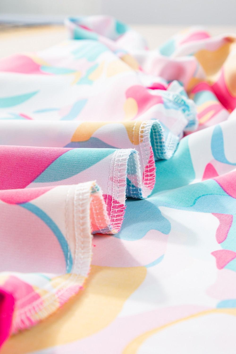 Plus Size Ruffled Printed Notched Cap Sleeve Blouse - ClubOn