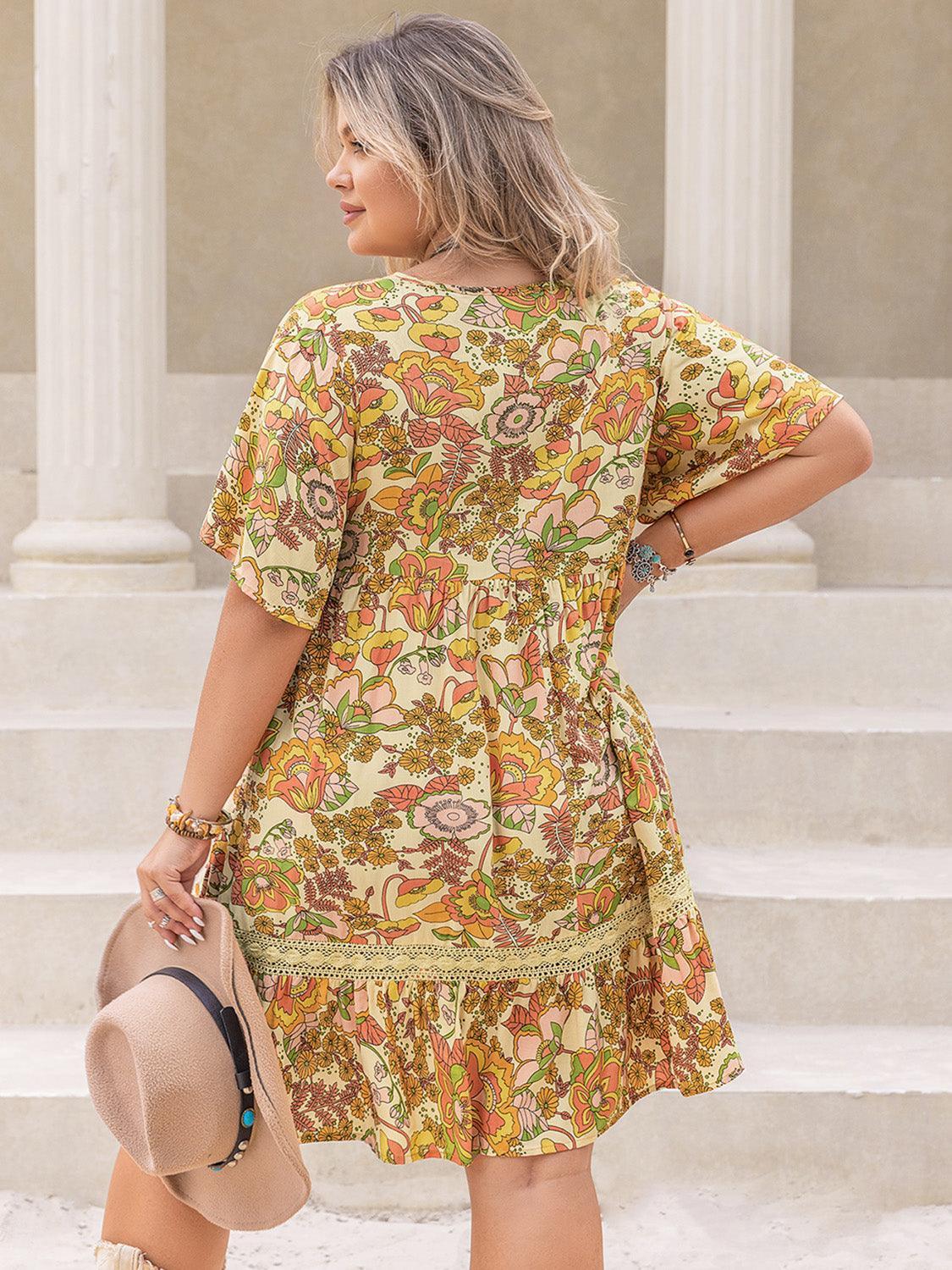 Plus Size Printed Tie Neck Short Sleeve Mini Dress - ClubOn