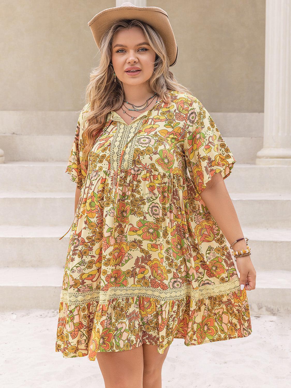 Plus Size Printed Tie Neck Short Sleeve Mini Dress - ClubOn