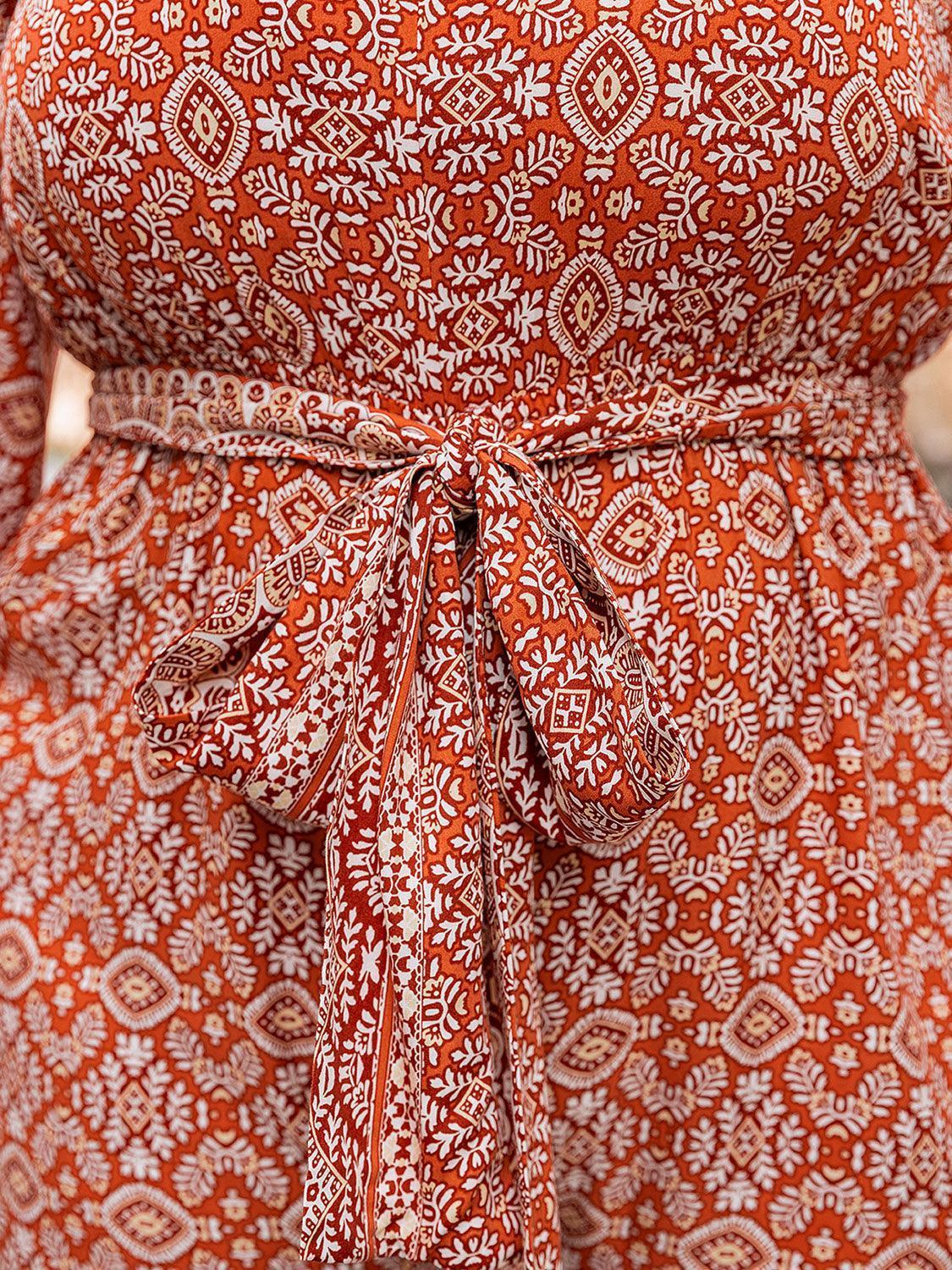 Plus Size Printed V-Neck Tie Front Balloon Sleeve Jumpsuit - ClubOn